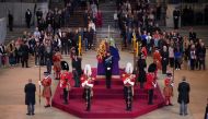 Queen Elizabeth II 's grandchildren (clockwise from front centre) the Prince of Wales, Peter Phillips, James, Viscount Severn, Princess Eugenie, the Duke of Sussex, Princess Beatrice, Lady Louise Windsor and Zara Tindall hold a vigil beside the coffin of their grandmother as it lies in state on the catafalque in Westminster Hall, at the Palace of Westminster, London, on Saturday September 17, 2022.  Yui MokPA Wire Yui Mok/Pool via REUTERS