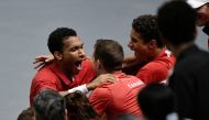 Canada's Felix Auger Aliassime celebrates with his team after winning his Davis Cup Group B match against Serbia's Miomir Kecmanovic  at the  Pavello Municipal Font de Sant Lluis in Valencia, Spain, on September 17, 2022.   REUTERS/Pablo Morano
