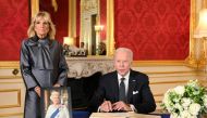 US President Joe Biden accompanied by the First Lady Jill Biden signs a book of condolence at Lancaster House in London, following the death of Queen Elizabeth II on September 18, 2022. Jonathan Hordle/Pool via REUTERS