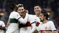 Portugal's Diogo Dalot celebrates scoring their third goal with Rafael Leao, Cristiano Ronaldo and Mario Rui during the UEFA Nations League Group B match against Czech Republic at the Eden Arena, Prague, Czech Republic, on September 24, 2022.  REUTERS/David W Cerny