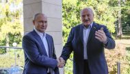 Russian President Vladimir Putin greets his Belarusian counterpart Alexander Lukashenko during a meeting in Sochi, Russia, on September 26, 2022. Sputnik/Gavriil Grigorov/Pool via REUTERS 
