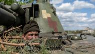 An Ukrainian soldier looks out from a tank, amid Russia's invasion of Ukraine, in the frontline city of Lyman, Donetsk region, Ukraine April 28, 2022. REUTERS/Jorge Silva/File Photo