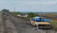 Cars from a civilian convoy, which Ukrainian State Security Service say was hit by a shelling from Russian troops amid Russia's attack on Ukraine, are seen near the village of Kurylivka in Kharkiv region, Ukraine, on October 1, 2022. REUTERS/Vitalii Hnidyi