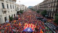 People hold up Esteladas (Catalan separatist flag) during the National Day Catalonia, called 'La Diada', in Barcelona, Spain, on September 11, 2021. File Photo / Reuters
