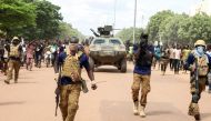 Soldiers escort the convoy of Burkina Faso's self-declared new leader Ibrahim Traore as he arrives at the national television standing in an armoured vehicle in Ouagadougou, Burkina Faso, on October 2, 2022. File Photo / Reuters
