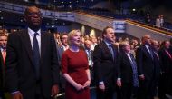 British Prime Minister Liz Truss, her husband Hugh O'Leary, Health Secretary Therese Coffey and Chancellor of the Exchequer Kwasi Kwarteng sing the national anthem, as they attend the annual Conservative Party conference, in Birmingham, Britain, on October 2, 2022. (REUTERS/Hannah McKay)