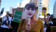 Protesters gather in support of Iranian women and against the death of Mahsa Amini at Callao square in Madrid, Spain, October 1, 2022. Reuters/Isabel Infantes/File Photo