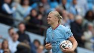 Manchester City's Erling Braut Haaland celebrates with the match ball after the match against Manchester United at the Etihad Stadium in Manchester on October 2, 2022.  Action Images via Reuters/Carl Recine