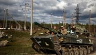 Ukrainians ride an armoured vehicle, amid Russia's attack on Ukraine, in Donesk region, Ukraine, on October 3 2022. REUTERS/Zohra Bensemra