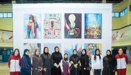 Minister of Social Development and Family H E Mariam bint Ali bin Nasser Al Misnad with Qatar Women’s Sports Committee members and artists of the mural.
