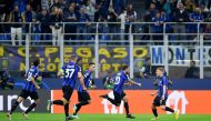 Inter Milan's Hakan Calhanoglu celebrates scoring their first goal with Lautaro Martinez and Nicolo Barella REUTERS/Daniele Mascolo
