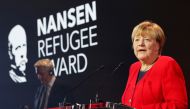 Angela Merkel speaks as she receives the UNHCR Nansen Refugee Award for protecting refugees at height of Syria crisis, during a ceremony in Geneva, Switzerland, October 10, 2022. (REUTERS/Stefan Wermuth)