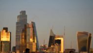 People cross Waterloo Bridge during the evening rush-hour with skyscrapers of the City of London financial district seen behind in London, Britain, on October 10, 2022. REUTERS/Toby Melville