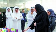 Minister of State and President of Qatar National Library H E Dr. Hamad bin Abdulaziz Al Kawari (second left) and H E Dr. Mohammed bin Saleh Al Sada (third right) with officials during a tour of the exhibition. 