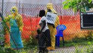 A woman and her child arrive for ebola related investigation at the health facility at the Bwera general hospital near the border with the Democratic Republic of Congo in Bwera, Uganda, June 14, 2019. REUTERS/James Akena/File Photo
