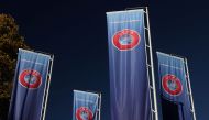 Flags with UEFA logo are seen outside of the Union of European Football Associations headquarters in Nyon, Switzerland, on October 5, 2022. REUTERS/Denis Balibouse/File Photo