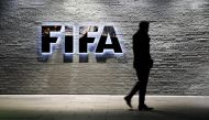 A journalist walks in front of FIFA's headquarters in Zurich, Switzerland December 2, 2015. File Photo / Reuters
