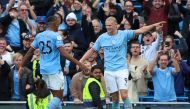 Manchester City's Erling Braut Haaland celebrates scoring their second goal against Brighton & Hove Albion with teammate Manuel Akanji at the Etihad Stadium in Manchester on October 22, 2022.  Action Images via Reuters/Molly Darlington