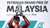 October 23, 2022 Ducati Lenovo's Francesco Bagnaia celebrates on the podium with trophy after winning the Malaysian Grand Prix REUTERS/Hasnoor Hussain