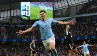 Manchester City's Argentinian striker Julian Alvarez celebrates scoring the opening goal during the English Premier League football match between Manchester City and Fulham at the Etihad Stadium in Manchester, north west England, on November 5, 2022. (Photo by ADRIAN DENNIS / AFP)