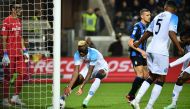 Napoli's Nigerian forward Victor Osimhen grabs the ball after scoring a header to equalize 1-1 during the Italian Serie A football match between Atalanta Bergamo and Napoli on November 5, 2022 at the Atleti Azzurri d'Italia stadium in Bergamo. (Photo by Isabella BONOTTO / AFP)