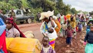 Congolese civilians carry their belongings as they flee near the Congolese border with Rwanda after fightings broke out in Kibumba, outside Goma in the North Kivu province of the Democratic Republic of Congo May 24, 2022.  File Photo / Reuters