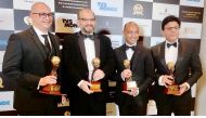 Tawfeeq Travel Group officials with the awards.