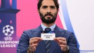 Champions League's ambassador Turkish former footballer Hamit Altintop shows the paper slip of Liverpool FC during the draw for the round of 16 of the 2022-2023 UEFA Champions League football tournament in Nyon on October 7, 2022. Photo by Fabrice Coffrini / AFP