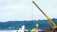 Workers use a crane to pull the crashed Precision Air aircraft out of Lake Victoria in Bukoba, Tanzania, on November 8, 2022. Photo by Sitide Protase / AFP