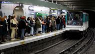 People stand at Gare Saint-Lazare metro station during a nationwide strike for higher wages and pensions in Paris, France, November 10, 2022. REUTERS/Gonzalo Fuentes