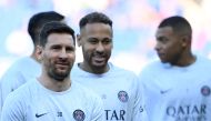 Paris Saint-Germain's Argentine forward Lionel Messi, Brazilian forward Neymar, and French forward Kylian Mbappe warm up prior to the French L1 football match between Paris Saint-Germain FC and AJ Auxerre at the Parc des Princes stadium in Paris on November 13, 2022. (AFP/Franck Fife)