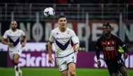 Fiorentina's Serbian defender Nikola Milenkovic and AC Milan's Portuguese forward Rafael Leao (R) go for the ball during the Italian Serie A football match between AC Milan and Fiorentina on November 13, 2022 at the San Siro stadium in Milan. (Photo by Filippo MONTEFORTE / AFP)