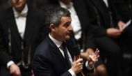 France's Interior Minister Gerald Darmanin (centre) speaks during a session of questions to the government at The National Assembly in Paris on November 15, 2022. (Photo by Christophe ARCHAMBAULT / AFP)