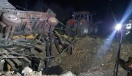 A damaged vehicle lies next to a crater formed at the site of an explosion in Przewodow, a village in eastern Poland near the border with Ukraine, in this photograph obtained by Reuters on November 16, 2022. 