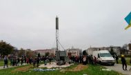 People gather in the central square of Kherson, after Kyivstar engineers installed the first mobile station, in Kherson, Ukraine November 13, 2022. Kyivstar/Handout via REUTERS