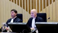 Presiding Judge Hendrik Steenhuis and Judge Dagmar Koster sit in the courtroom as the Dutch court announces its ruling in the MH17 trial of three Russians and a Ukrainian in the Schiphol Judicial Complex, Badhoevedorp, Netherlands, November 17, 2022. (REUTERS/Piroschka van de Wouw)