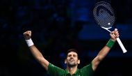 Serbia's Novak Djokovic celebrates after winning his round-robin match against Russia's Daniil Medvedev on November 18, 2022 at the ATP Finals tennis tournament in Turin. (AFP/Marco  Bertorello)