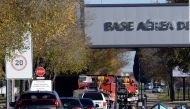Military police stand guard at the main entrance of the Spanish air force base, in Torrejon de Ardoz near Madrid, on December 1, 2022, after Spain's security forces found a 