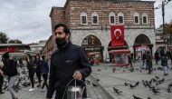 File photo: Tea is taken in bazaars across the country, where tea-sellers still walk the streets of the city serving the drink to traders and their customers, in Istanbul, Turkey. (AFP/Ozan Kose)