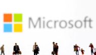 Small figurines are seen in front of displayed Microsoft logo in this illustration taken February 11, 2022. File Photo / Reuters