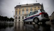 File Photo: A police car parks in front of the Austrian federal chancellery in Vienna, Austria, October 7, 2021. (REUTERS/Lisi Niesner)