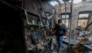 Local resident Pavel gathers belongings of his neighbour, who was killed in recent shelling, in his neighbour's house destroyed in the course of Russia-Ukraine conflict in Donetsk, Russian-controlled Ukraine, December 10, 2022. REUTERS/Alexander Ermochenko