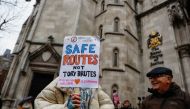 Protesters demonstrate outside the High Court over the legal challenge against the government's policy to deport illegal immigrants to Rwanda in London, Britain December 19, 2022. Reuters/Peter Nicholls