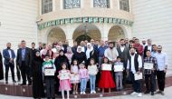 Chargé d’Affaires of Syrian Embassy in Qatar, Dr. Bilal Turkiyeh along with other officials and community members during the honouring ceremony.