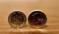 A photograph shows one Kuna and one Euro coins in Zagreb on December 30, 2022. (Photo by Denis LOVROVIC / AFP)