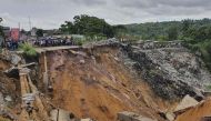 This file photo taken on November 26, 2019 shows a road surface swept away by a landslide caused by torrential overnight rains in the Lemba district of the capital Kinshasa in the Democratic Republic of Congo. (AFP)
