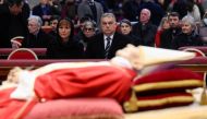 This handout picture taken and released on January 3, 2023 shows Hungarian Prime Minister Viktor Orban (second left) and his wife Aniko Levai paying their respect to Pope Emeritus Benedict XVI as his body lays in state at St. Peter's Basilica in the Vatican.  (Photo by Handout / VATICAN MEDIA / AFP)