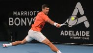 Serbia's Novak Djokovic hits a return against Canada's Denis Shapovalov during their men's singles quarter-final match at the Adelaide International tennis tournament in Adelaide on January 6, 2023. (Photo by Brenton EDWARDS / AFP)