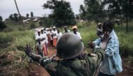 File Photo: A militiaman of the armed group URDPC/CODECO stopped a religious procession in the village of Masumbuko, Ituri Province, northeastern Democratic Republic of Congo on September 18, 2020. (AFP)