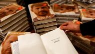 A person looks at a copy of Britain's Prince Harry's autobiography 'Spare' displayed at Waterstones bookstore, in London, Britain January 10, 2023. REUTERS/Peter Nicholls